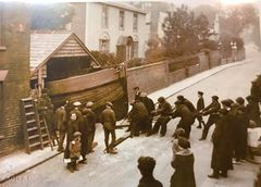 Fishing Boat being moved out of builder's shed